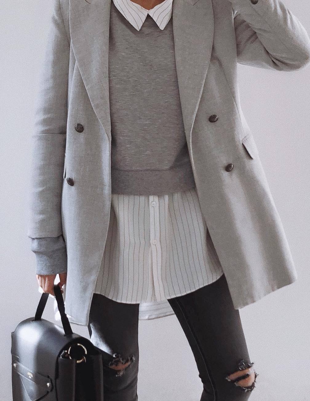cute fall outfit idea / sweatshirt + grey coat + striped shit + bag + jeans