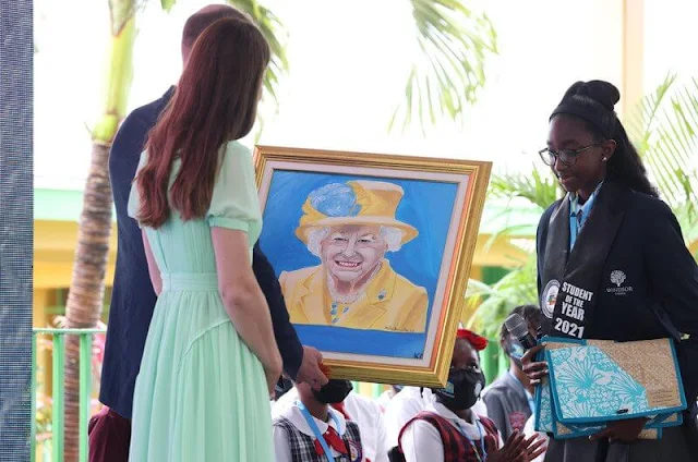 Kate Middleton wore a pleated chiffon midi dress by Self-Portrait, and gold maya earrings by Nadia Irena