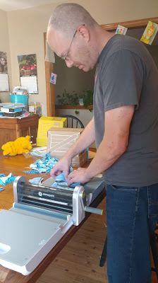 My husband using an AccuQuilt GO! cutter