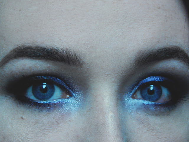 close up of dark eyeshadow on person with blue eyes