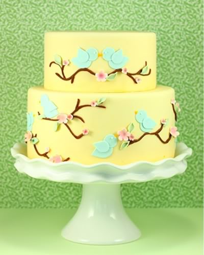 Gorgeous spring time yellow wedding cake with bluebirds