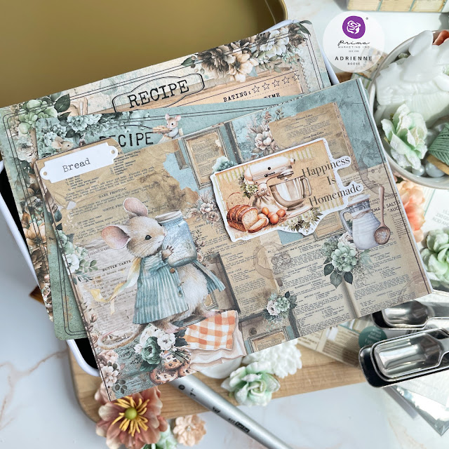 Altered recipe tin decorate with Prima Marketing the Home Baker collection Sticker Roll, Moulds, and Flowers; recipe cards and dividers created with The Home Baker 6x8 and 6x6 Patterned Paper Pads, Decoupage Paper, Ephemera, and Stickers.