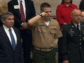 A wounded soldier salutes during one of President Bush's State of the Union Addresses