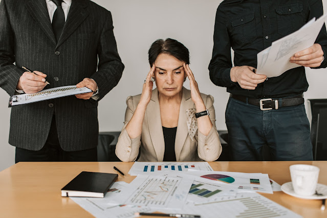 Photo by Vlada Karpovich from Pexels: https://www.pexels.com/photo/stressed-woman-between-her-colleagues-7433871/