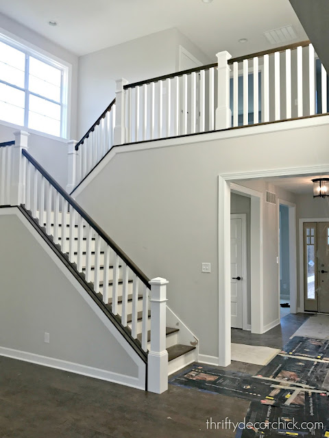 wood stairs, white newel posts, stained hand rails