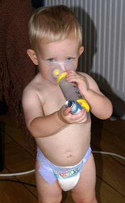 small child using the Ventolin inhaler