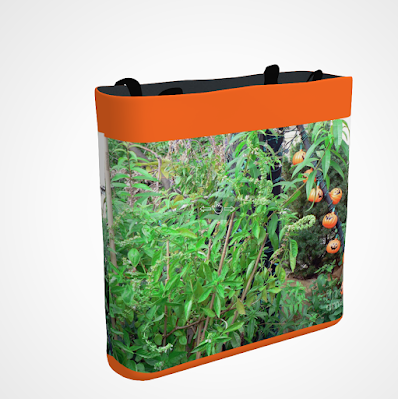This screen-shot features an orange tote/bag/pouch which has an image imprinted on it. The picture was taken in my garden when decorated for Halloween. It shows eight little pumpkin outdoor lights amongst the flora. The tote is available in three sizes (13" by 13", 16" by 16" and 18" by 18") and can be purchased via Fine Art America @ https://fineartamerica.com/featured/eight-little-pumpkins-patricia-youngquist.html?product=tote-bag