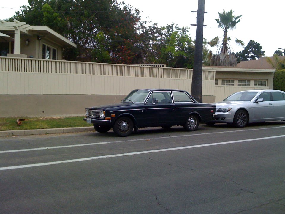 Black Volvo 142 minding it's own business Never mind that big ugly 740IL