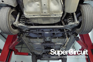 The SUPERCIRCUIT Rear Lower Brace is installed to the rear chassis of the Honda City GM6.