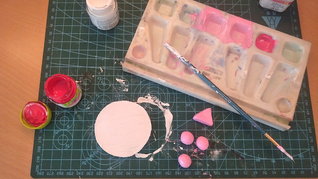 Painting my clay objects with white and pastel pink