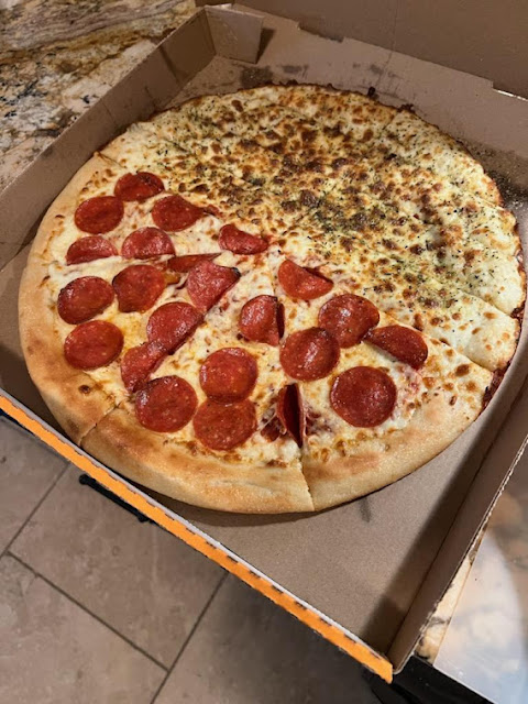 Little Caesars pizza: half pepperoni, half Italian bread