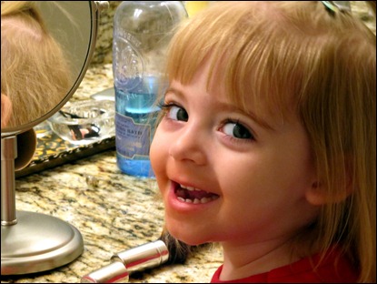 Elaine putting on makeup