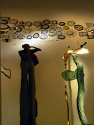 In the spirit of DIY, curved mirrors, a wall of clocks and Dali piece.