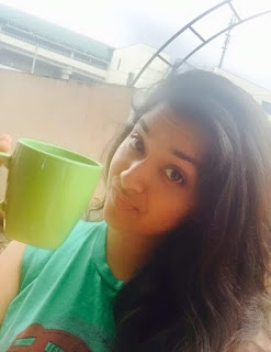 Keerthy Suresh in Green T-shirt with Cute and Awesome Lovely Expressions While Drinking Coffee