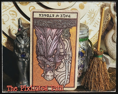 The Page of Stones card from The Dark Crystal Tarot in the reversed position.