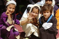 Children from Gulam Ali village, Afghanistan, gather at the opening ceremony for their new all-girls school on June 7. Soldiers from 101st Headquarters Support Company and the 101st Division Band attended the school’s opening, and the HSC soldiers provided wood for the school staff to build desks. (U.S. Army photo by Sgt. Jessica R. Dahlberg)