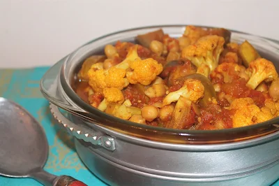 Pot of Stewed Indian-spiced eggplant, cauliflower, and chickpeas.
