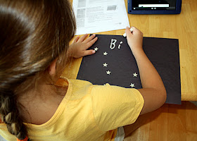Tessa wrote "Big Dipper" and dotted in other stars with white chalk.