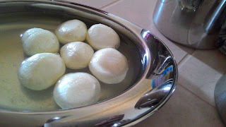 Remove from the heat and let the stuff cool down. Put the balls and the syrup in a storage container and cool 4-5 hrs. Rasgulla naw are ready for Serving.