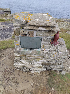 Monument to the last Great Auk living in the United Kingdom. Stone monument with plaque and red model of a Great Auk.