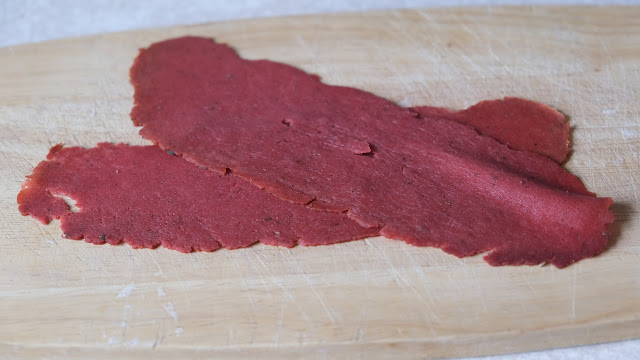 Squeaky Bean Pastrami  on a wooden chopping board