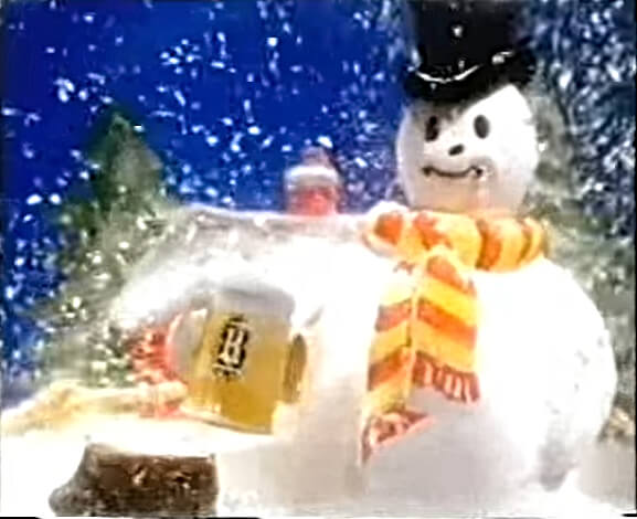 DEC 12 - HEINEKEN SNOWMAN ADVERT 1984. Christmas ad for the Dutch lager featuring a snowman in a snow globe.