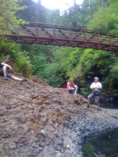 family resting on the trail