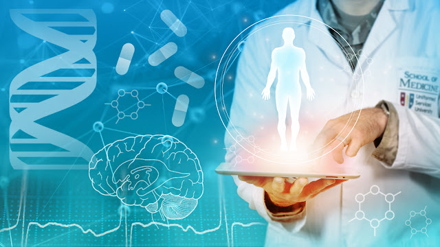 Digital composite image related to medical science. The foreground features a doctor in a lab coat with the emblem of the School of Medicine on it, holding a transparent tablet that displays a hologram of a human figure. The background shows a vibrant blue with graphics of a DNA double helix, pills, molecular structures, and a detailed brain illustration to the left. These elements collectively signify innovation and research in medical technology and neuroscience.