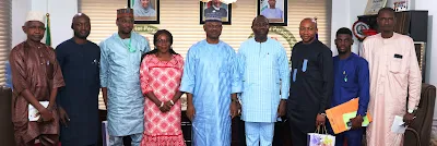 Members of the ID4D Delegation posing for a Photograph with  the Executive Secretary, NCPWD, during the visit