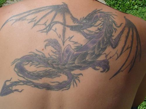 dragon back tattoo. dragon tattoo back. tribal