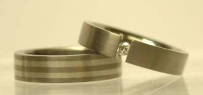 silver wedding ring titanium band with tension set brilliant diamond