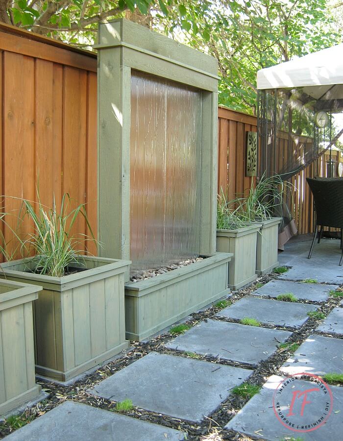 Budget-Friendly DIY Paver Block Patio with lovely DIY water wall feature.