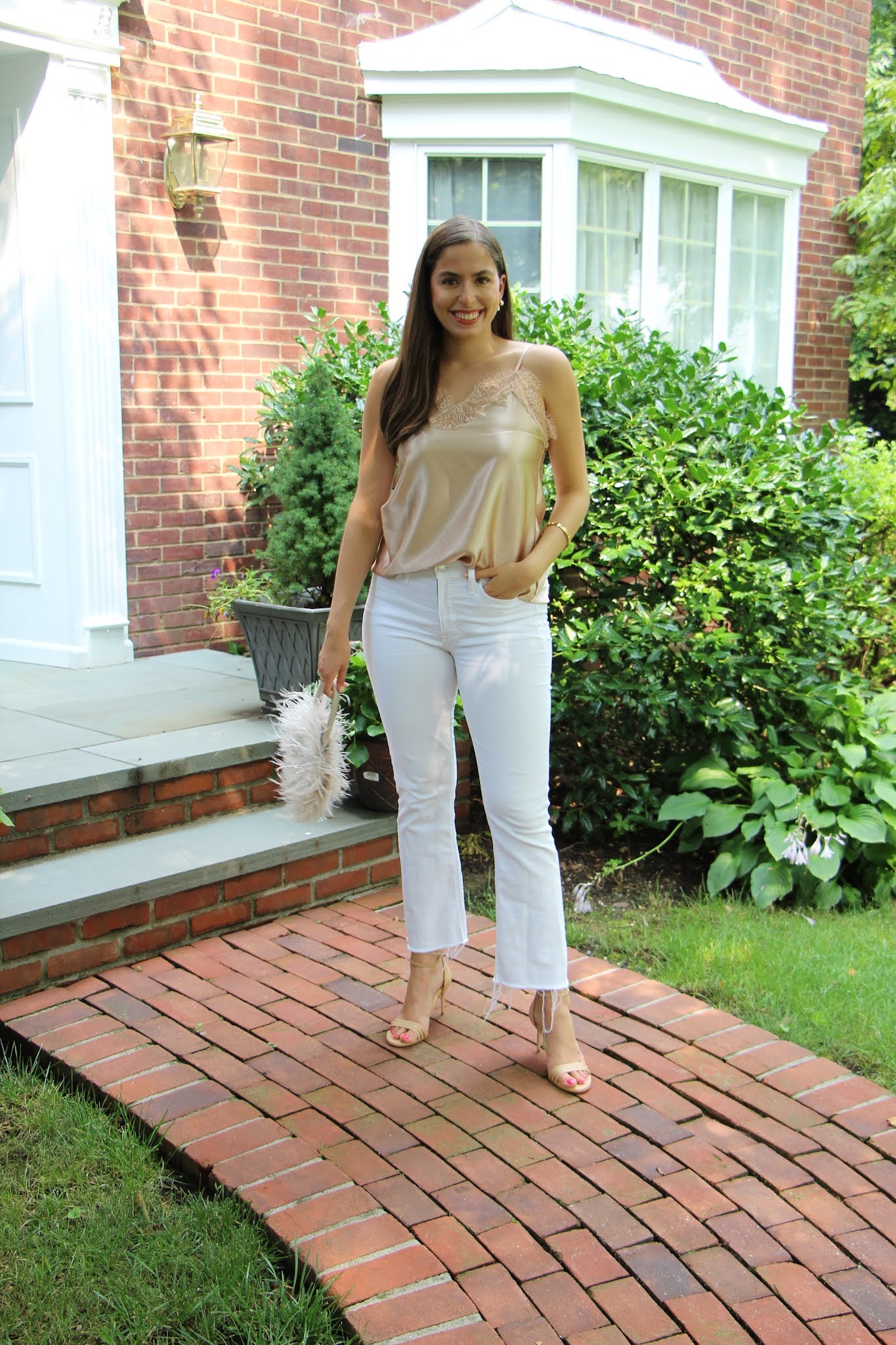 white jeans, sarah flint, lace tank top, satin tank top, feather bag