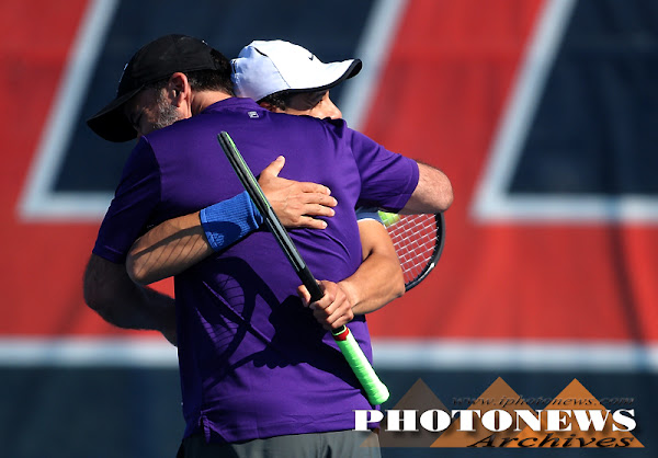 tennis players hug