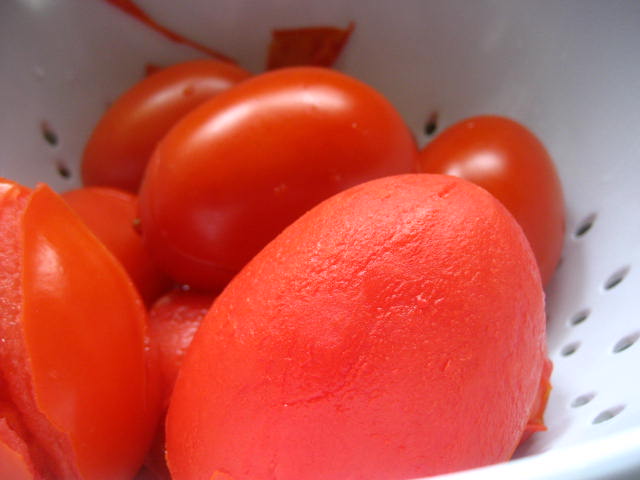 Slice tomatoes in half after peeling and chop into small pieces. Add ...