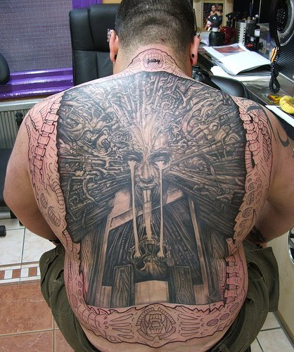 Detailed back piece tattoo.
