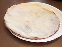 Raw pizza dough round