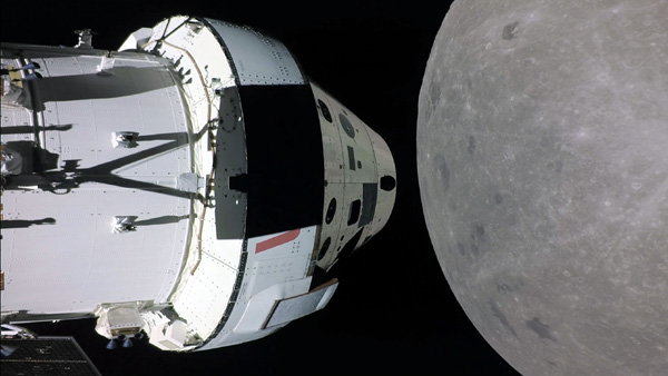 A snapshot of NASA's Orion spacecraft flying past the Moon on the Artemis 1 mission.