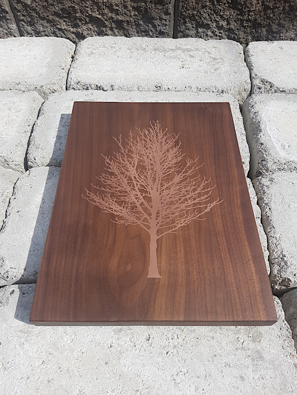 Walnut board with tree made out of epoxy resin and copper powder