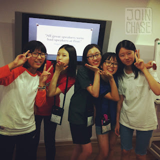 Middle school girls pose for a photo in a classroom in South Korea.