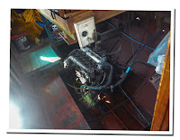 engine of slow boat in mekong river