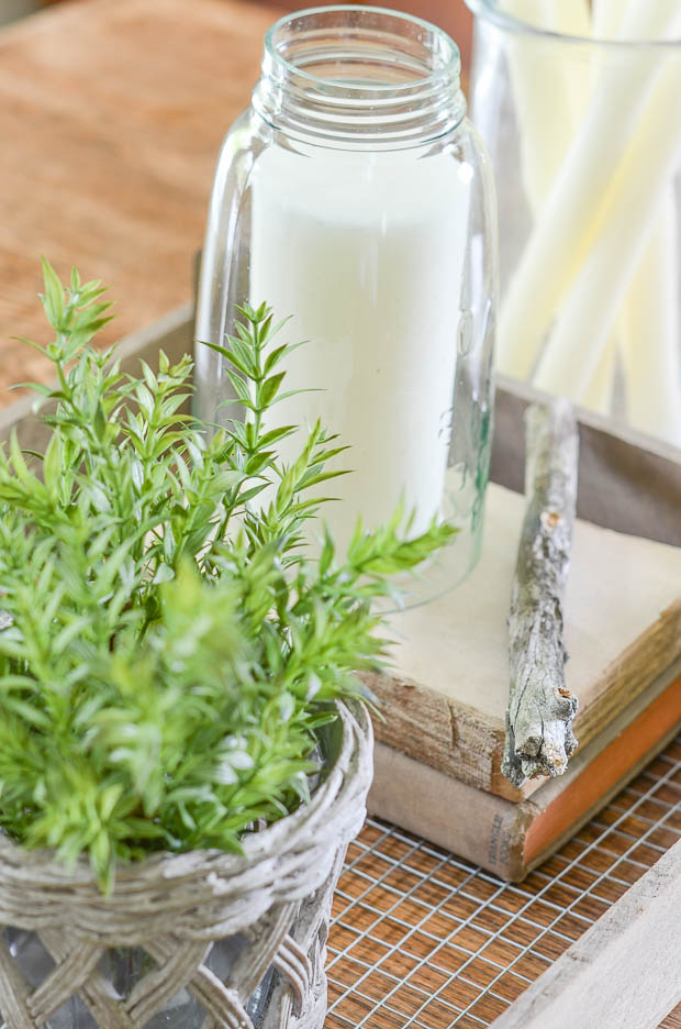 Use a rustic tray for displaying a collection of objects on your table.