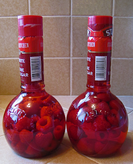 Two Bottles of Red Vinegar with Raspberries