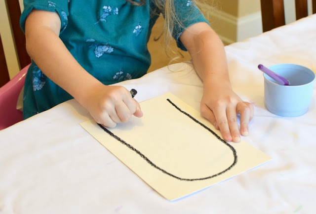 Halloween Rainbow Ghost Garland Craft with Watercolor Resist.  Fun art project for toddlers, preschoolers, or elementary kids for Halloween- bright and cheerful, not spooky!