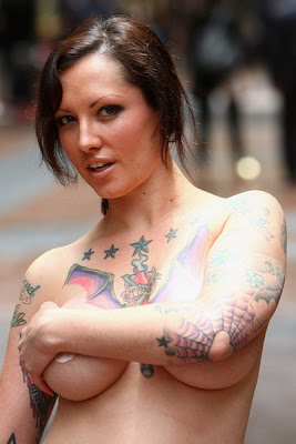 Tattooed Model Stands For PETA Protest