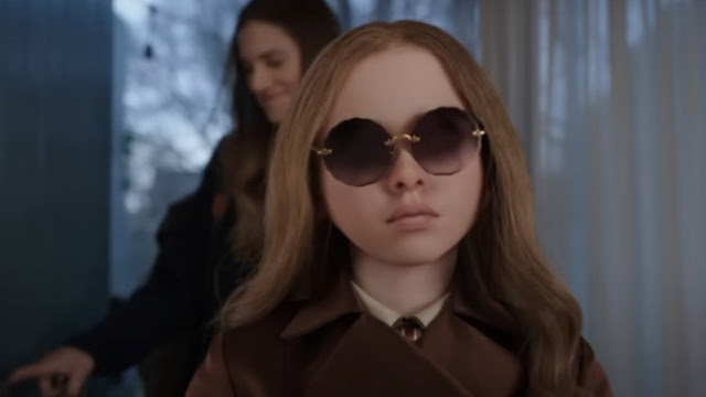 a murder doll with sunglasses