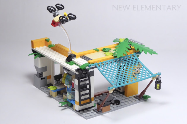a front view of the ramshackle service station with the lattice holed awning and drone above