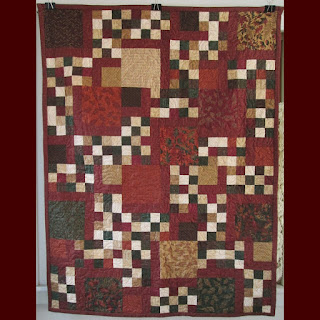 Brown, dark red, and green quilt