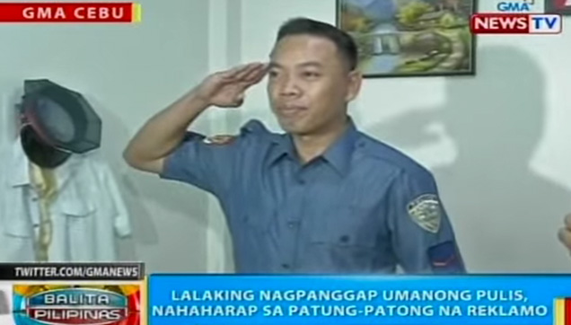 The Fake Policeman doing a salute in front of the media.