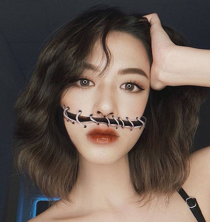  A self-taught artist from Vietnam turns her face and body into amazing optical illusions